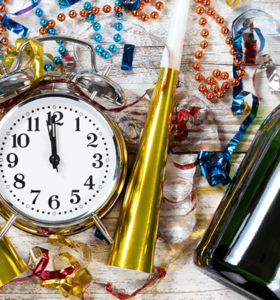 new year's resolutions for back pain with clock and champagne