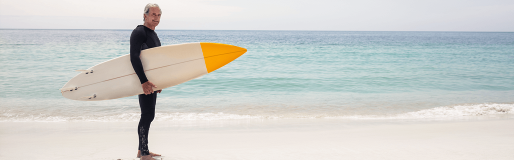 Man surfing after receiving minimally invasive microdisectomy