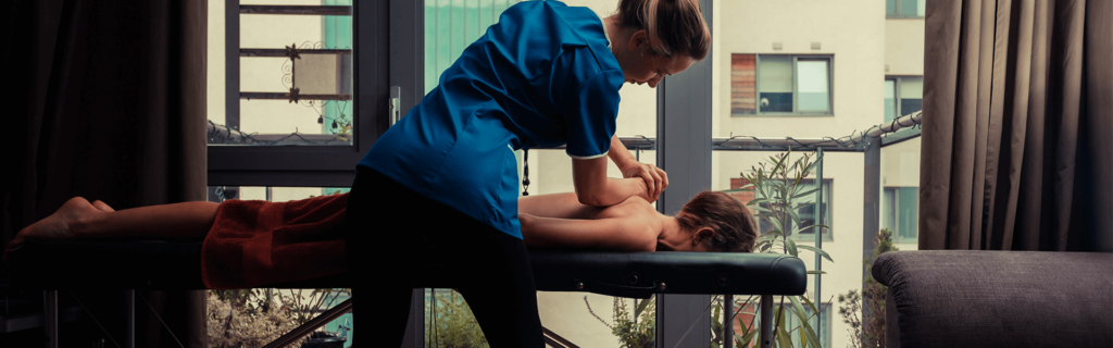 woman receiving massage therapy for back pain